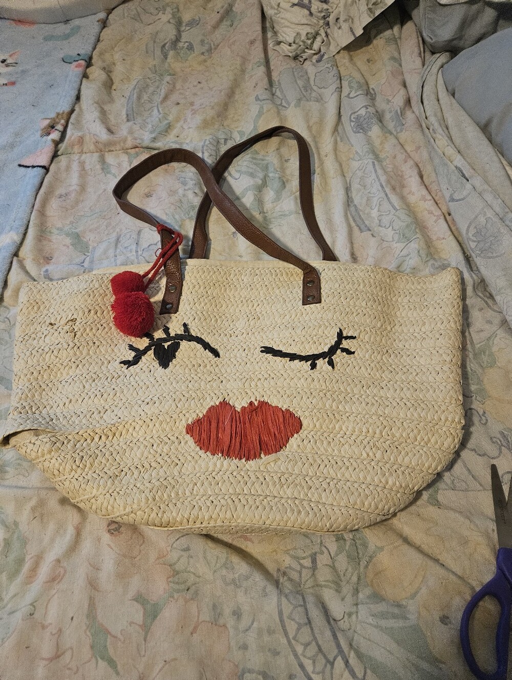 Straw Tote Bag with Red Lip Accent and Pom Pom